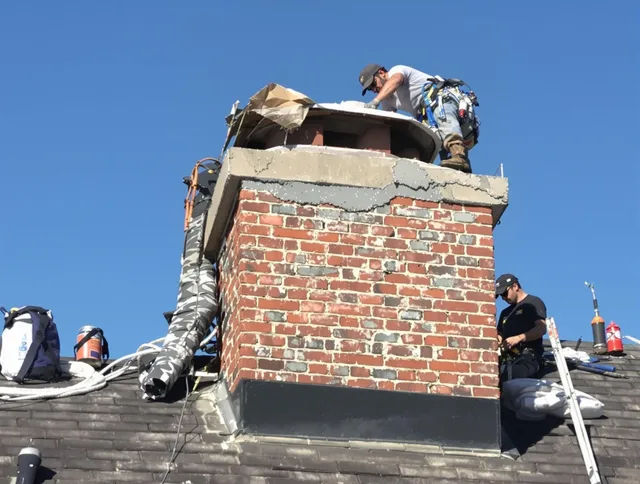 Eastlake Chimney Sweep installing a custom chimney crown in Eastlake, OH