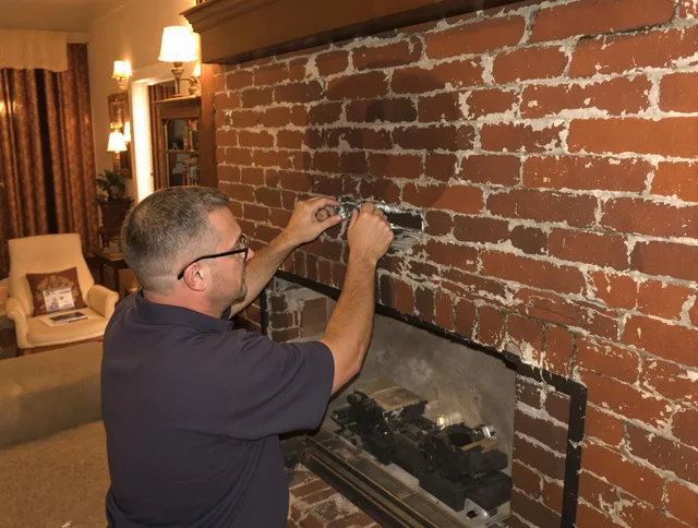 Eastlake Chimney Sweep expert fixing a fireplace in Eastlake, OH
